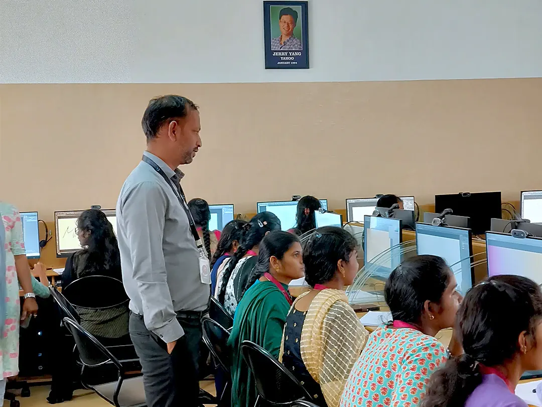 Alpha6 trainer leading an institutional multimedia training session in a college computer lab in Coimbatore